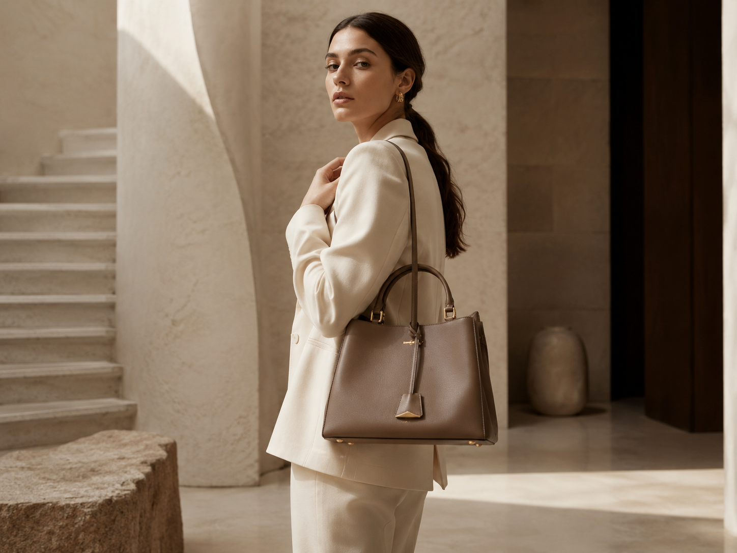 Shadove Luxe campaign — model with handbag, architectural interior